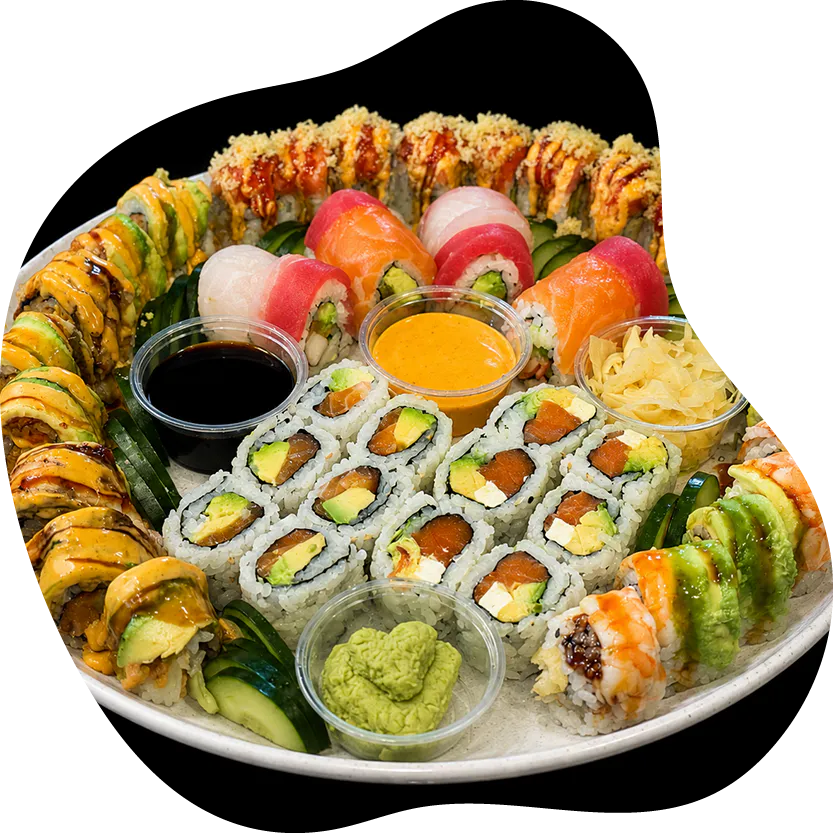 Assorted sushi platter with rolls, sashimi, and dipping sauces at Red Apple Buffet, a Buffet restaurant in Chicago